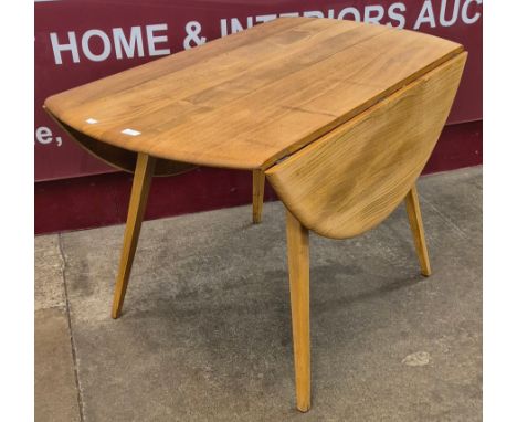 An Ercol Blonde elm and beech Windsor drop-leaf table 