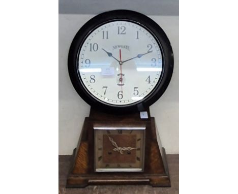 An early 20th Century Art Deco oak mantle clock and a Newgate metal wall clock 