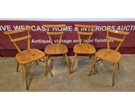 A set of four Ercol elm and beech green dot adult's chairs 