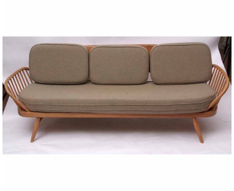 Retro mid-century Ercol light elm day-bed with surf board back, raised on splayed tapering legs, 210cms wide, with green upho