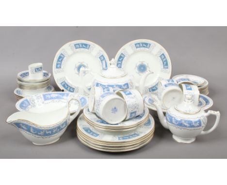 A collection of Coalport teawares and dinnerwares in the Revelry design to include teapots, gravy boat, cup and saucers etc, 