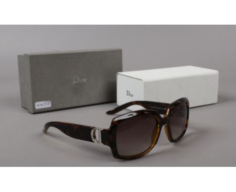 A boxed pair of ladies Christian Dior sun glasses.Condition report intended as a guide only.Used but in good condition.