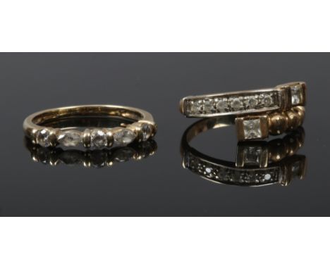 A 14ct gold ring set with white paste stones and a 9ct gold example.