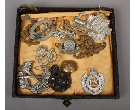 A collection of British military badges to include Royal Army ordnance corps, Royal Engineers, Royal Warwickshire etc.