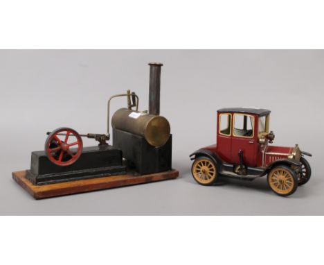 A Schuco tin plate model of a 1917 A Ford Coupe T along with a live steam flat bed engine.