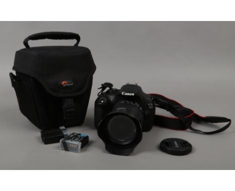 A Canon EOS 200D 24.2 mp DSLR camera with canon EF- S 18 - 55mm zoom lens and three batteries, along with Lowepro camera bag.