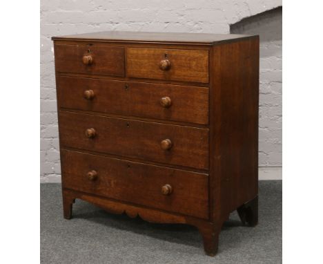 A Victorian carved oak chest of two over three graduated drawers raised on bracket feet (Height 160cm, Width 120cm, Depth 53c