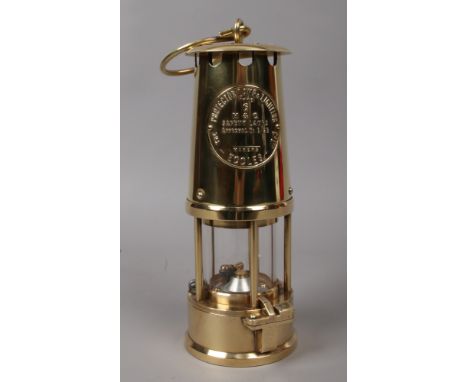 An Eccles brass miners safety lamp type 6.