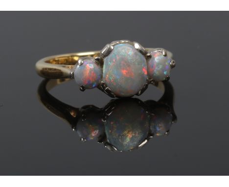 A 18ct gold ladies three stone opal ring size L gross weight 3.44 grams.