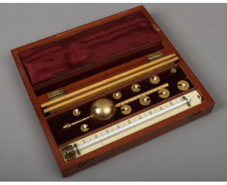 A mahogany cased Sikes hydrometer.