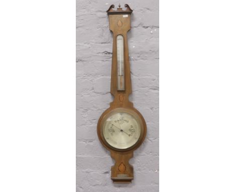 A presentation Edwardian inlaid mahogany banjo barometer by Godsmiths Co. Newcastle on Tyne.