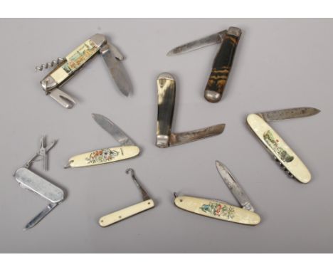 A collection of eight pen knives / multi tools to include antler and bone examples.