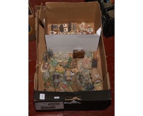 A box of ceramic models of cottages including Lilliput Lane examples.