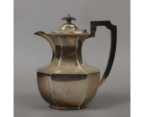 A George V silver hot water jug by R. F. Mosley &amp; Co. Baluster and canted rectangular form with hardwood handle and knop.