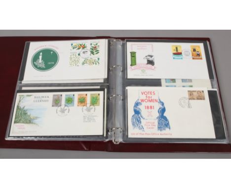 An album of first day covers and PHQ cards including Isle of Man and Guernsey examples.