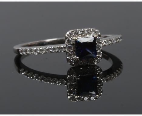 A boxed 18ct white gold sapphire and diamond cluster ring size O, gross weight 2.69 grams.