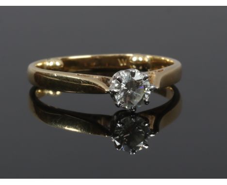 An 18ct gold diamond solitaire ring, approximately 0.33ct with sizing beads J.