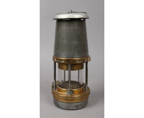 A William Maurice Wolf type FS miners lamp, brass plate to top stamped G. P. O 1965.