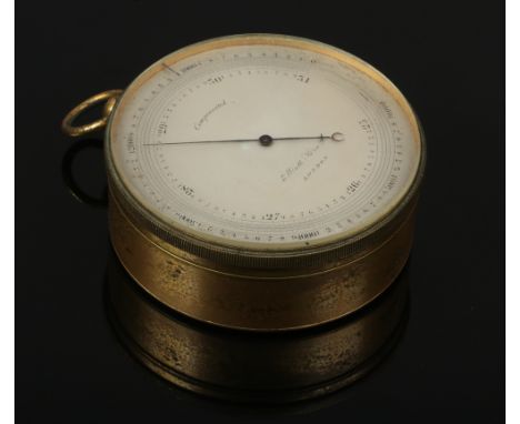 A 19th century brass cased pocket barometer, silvered dial signed Elliot Bros London.Condition report intended as a guide onl