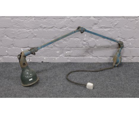A mid 20th century Industrial workshop lamp. With adjustable arm and enamel shade.&nbsp;