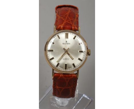 A gentleman's 9ct gold Buren manual wristwatch with satin dial and baton markers.Condition report intended as a guide only.No