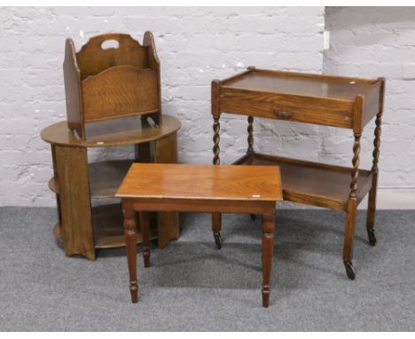 A group lot to include, mahogany three tier occasional table, oak magazine rack, barleytwist tea trolley and a turned leg sto