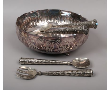 A silver plate patch 1 salad bowl raised on three small feet along with similar style servers.