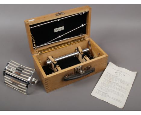 A cased vintage Revealer water detection device by J. C. Oliver Limited with instruction manual.