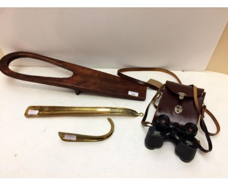 A long brass shoe horn, and a short one, a mahogany boot jack, a pair of Vintage binoculars in case stamped Carl Zeiss Jena 8