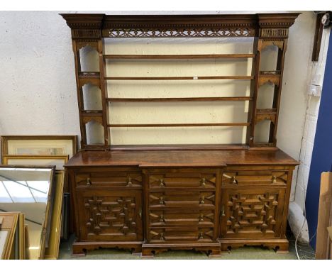 C17th style oak breakfront dresser, with geometric carved panel cupboard doors,  together with oak dresser top with pierced d