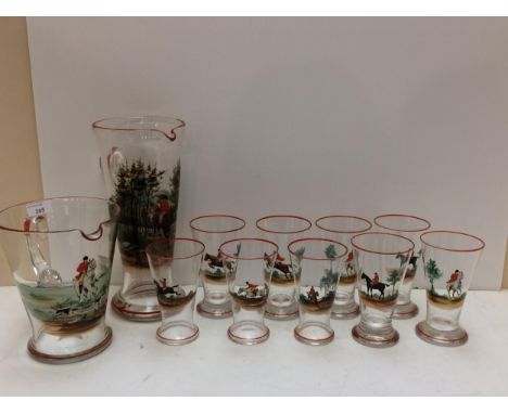 A vintage, decorative hunting themed glass set comprising a tall lemonade jug, a wide Pimm's jug and 8 glasses 