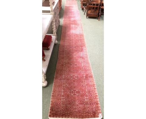 Rugs: A Long red ground runner 2 with all over geometric stylized patterns&nbsp;72cm x 722cm