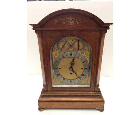 A large square framed oak and brass inlaid bracket clock, E White, 20 Cockspur Street, London,  brass movment with back plate