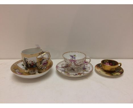 Royal Worcester hand painted cabinet cup, and two continental C19th hand painted footed cups and saucers 