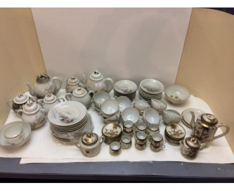 Japanese Noritake ceramic tea service, decorated landscapes; and a Japanese Noritake egg shell porcelain, decorated ladies 
