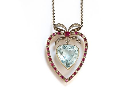 AQUAMARINE, RUBY AND DIAMOND PENDANT, 1910s the heart-shaped aquamarine swing centre to an outer frame set with oval mixed-cu