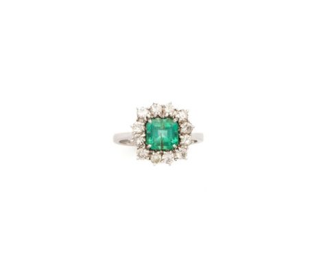 EMERALD AND DIAMOND RING cluster design, centring on a square-cut emerald framed by brilliant-cut diamonds, ring size N