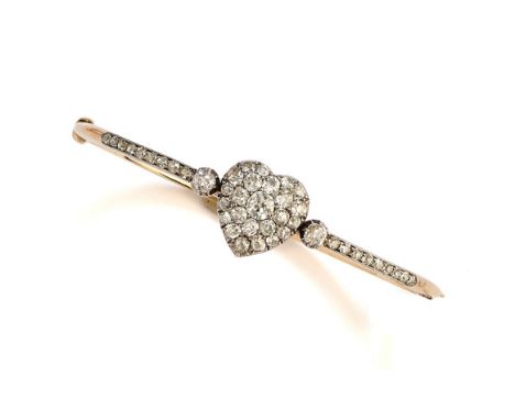 GOLD AND DIAMOND HINGED BANGLE, 1890s centring on a heart set with circular-cut diamonds, to similarly set shoulders, inner c