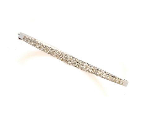 DIAMOND HINGED BANGLE the hinged bangle set with a graduated line of brilliant-cut diamonds, inner circumference 16cm