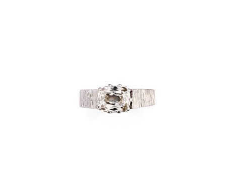 DIAMOND RING, 1970s claw set with a old mine-cut diamond, to a textured mount, ring size L 1/2