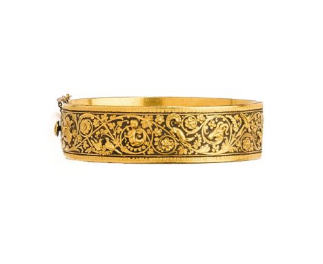 GOLD DAMASCENED IRON BANGLE, PROBABLY EIBAR, BASQUE REGION, EARLY 20TH CENTURY the gold cased bangle appiled with to the exte