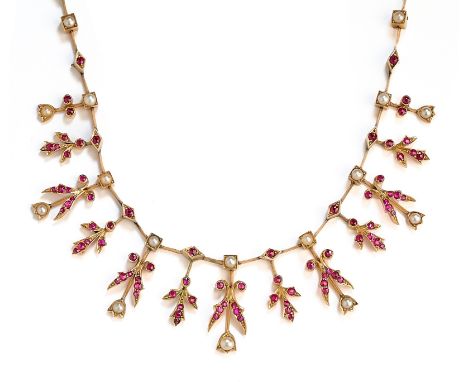 GOLD RUBY AND DIAMOND NECKLACE, 1890s of fringe design set with circular-cut rubies and half-pearls to knife-edge bar connect