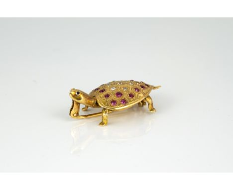 An 18ct gold, ruby and diamond brooch in the form of a tortoise, maker's mark WL, the heart-shaped shell pavé set with round 