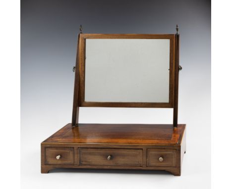 A George III inlaid mahogany box base toilet mirror, the rectangular plate with boxwood strung frame, within channelled uprig