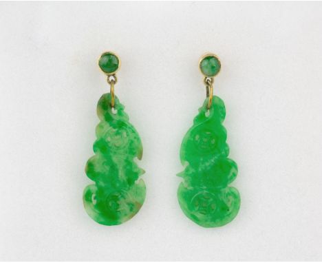 A pair of 18ct yellow gold and jade drop earrings, the carved and pierced apple green jade depicting bats with pierced mons t