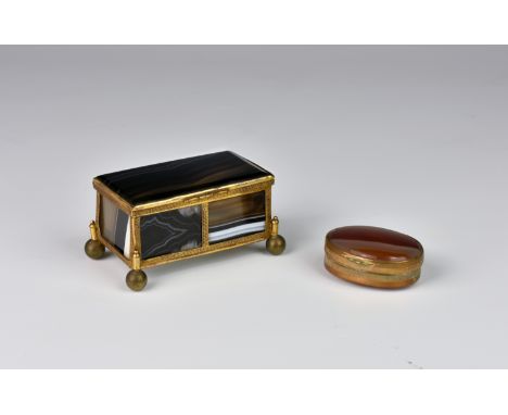 A late 19th century gilt-metal mounted banded agate casket, of plain rectangular form, raised on four ball feet, 3¼in. (8.3cm