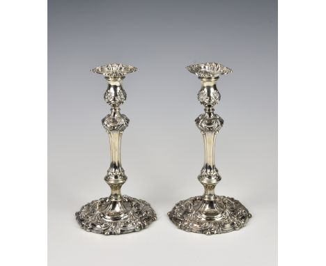 A good pair of George III silver candlesticks, S. C. Younge & Co., Sheffield 1813, the fluted capitals with swags and foliate