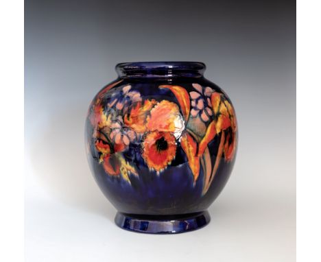 A large Moorcroft Orchid vase, 1930s, the globular form vase with short, slightly flared foot and roll rim, decorated with tw