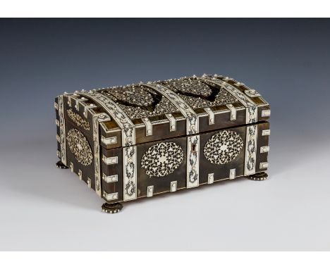 An Anglo-Indian Vizagapatam horn and ivory penwork work box, Vizagapatam, 19th century, domed casket form, the exterior decor