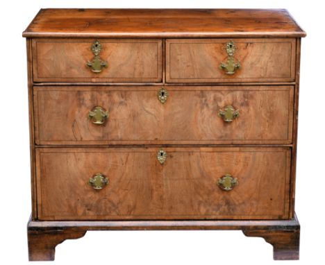 A Queen Anne walnut veneered chest of drawers, formerly the base of a chest on chest, c.1710, with stained pine and oak top, 
